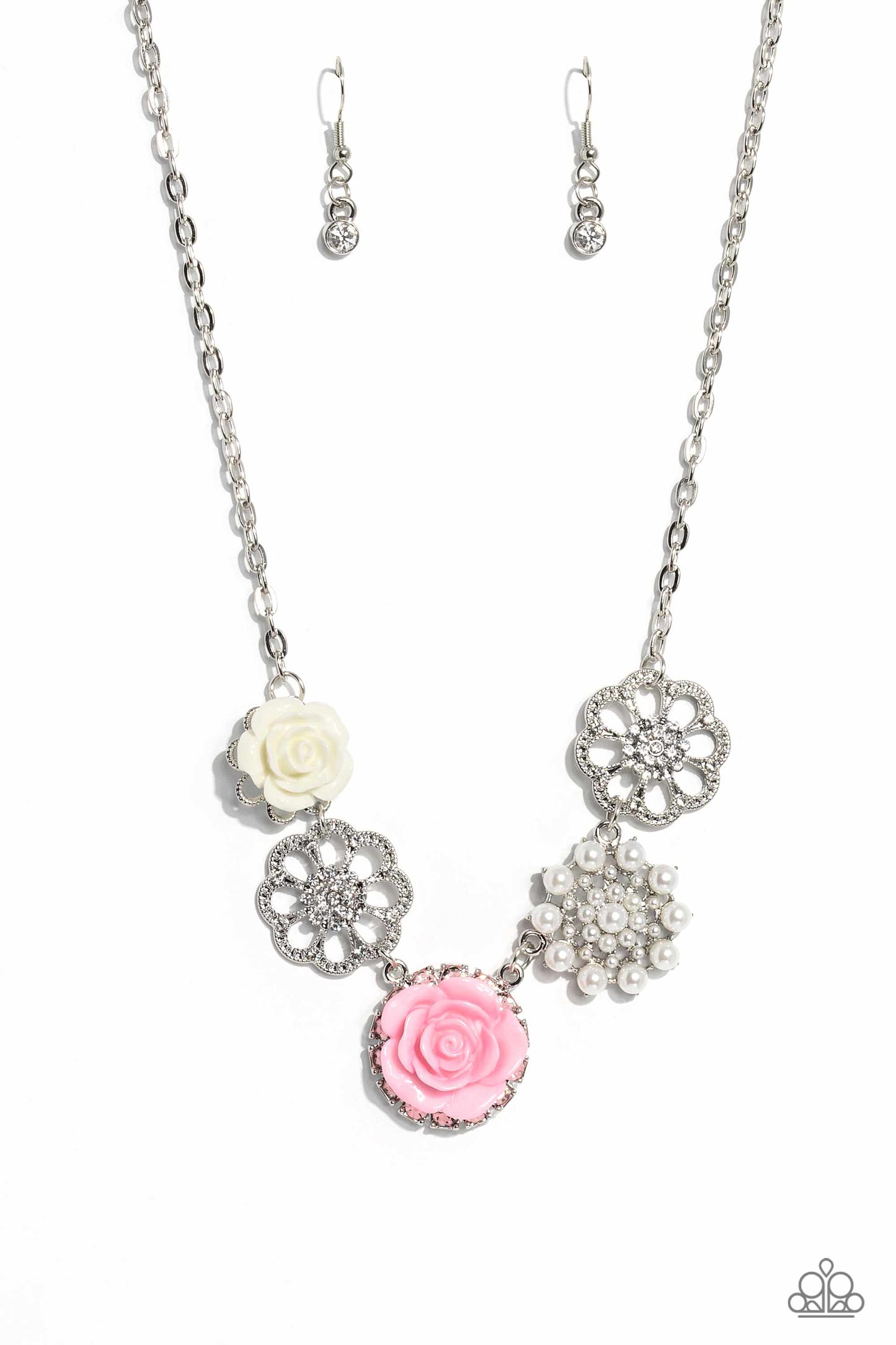 Paparazzi Accessories Tea Party Favors - Pink A collection of whimsical, refined flowers gathers along a flat, sleek silver link chain. The featured charms include an ivory resin rose blooming atop a glittery silver floral silhouette, two silver flowers d