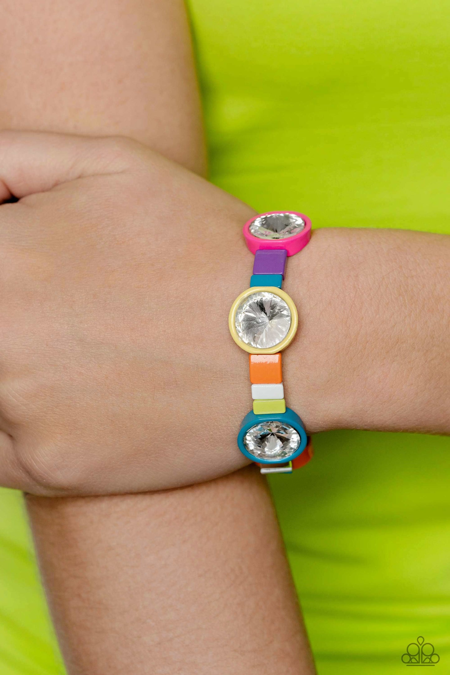 Paparazzi Accessories Multicolored Madness - Multi Strung along elastic stretchy bands, a bodacious collection of silver accents, and varying metallic accents dipped in multicolored shades encircle the wrist. Sporadically infused between the colorful disp