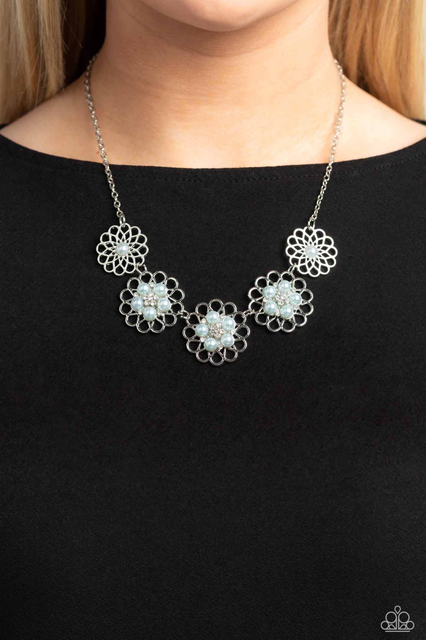 Paparazzi Accessories Mandala Mosaic - Blue Gleaming silver flowers with airy filigree petals are dotted with dainty white rhinestones and Skylight pearl centers for a refined design. The Skylight pearls and dainty white rhinestones form into a smaller fl