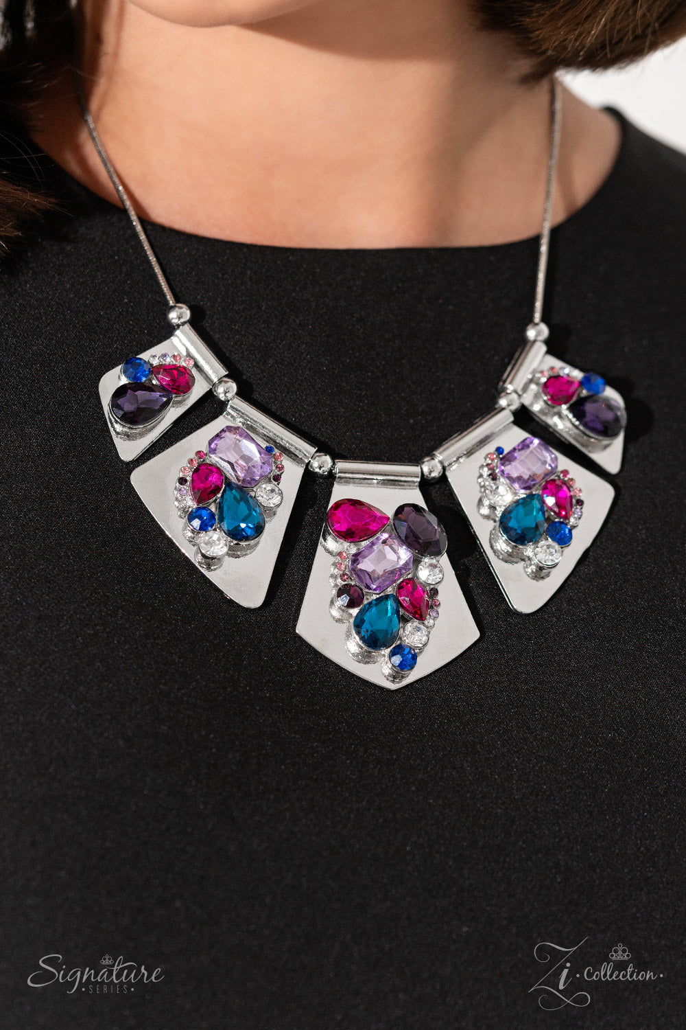 Paparazzi Accessories The Laura Shimmery silver plates slide along a skinny snake chain, with sleek metallic beads separating each one. Clusters of faceted gems are haphazardly staggered across the surface of each silver canvas, emitting a treasure trove