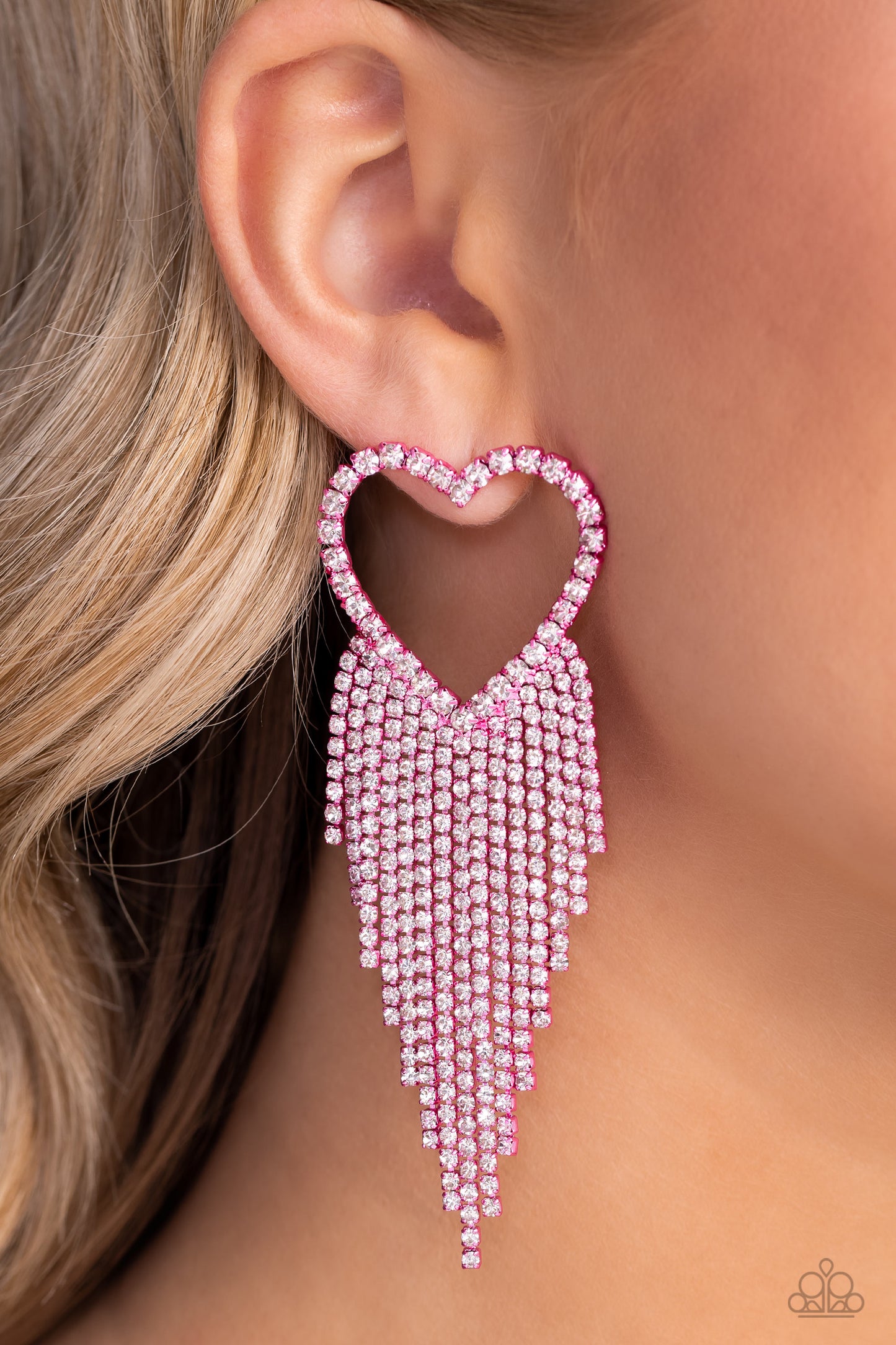 Paparazzi Accessories Sumptuous Sweethearts - Pink Glassy white rhinestones, encrusted along the front of a pink heart frame, create a flirty centerpiece. Staggered rows of white rhinestones pressed in delicate pink square fittings cascade from the sparkl