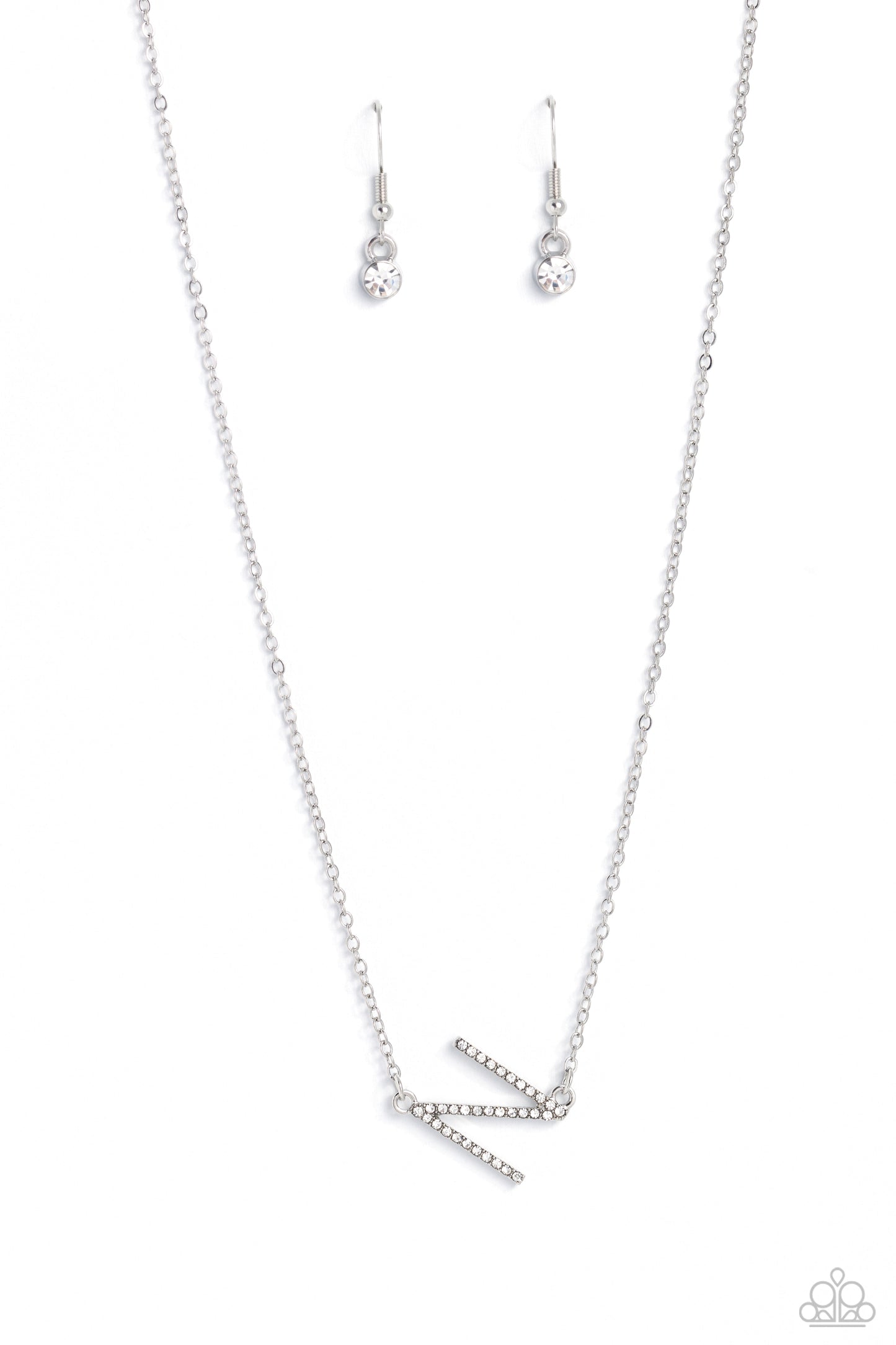 Paparazzi Accessories INITIALLY Yours - N - White Embossed with dainty white rhinestones, a silver letter "N" hovers below the collar from a dainty silver chain, for a sentimentally simple design. Features an adjustable clasp closure. Sold as one individu