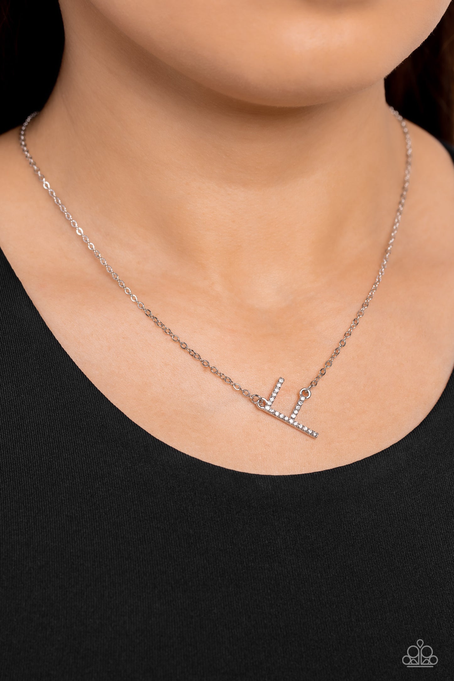 Paparazzi Accessories INITIALLY Yours - F - White Embossed with dainty white rhinestones, a silver letter "F" hovers below the collar from a dainty silver chain, for a sentimentally simple design. Features an adjustable clasp closure. Sold as one individu