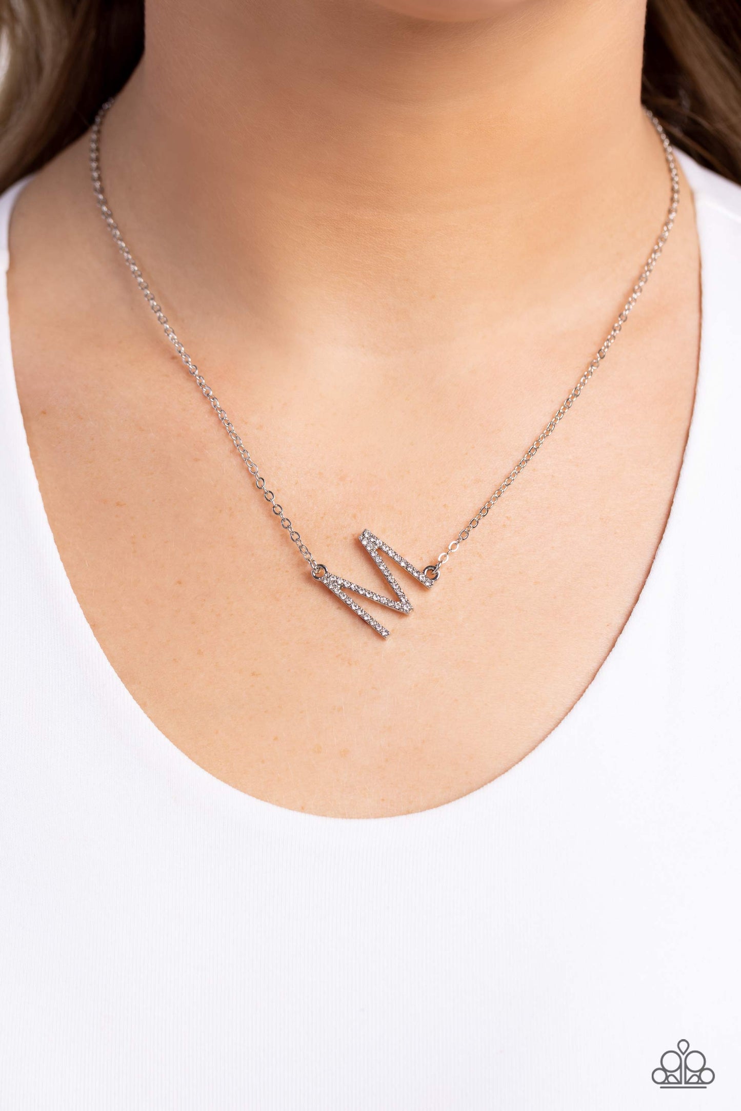 Paparazzi Accessories INITIALLY Yours - M - White Embossed with dainty white rhinestones, a silver letter "M" hovers below the collar from a dainty silver chain, for a sentimentally simple design. Features an adjustable clasp closure. Sold as one individu