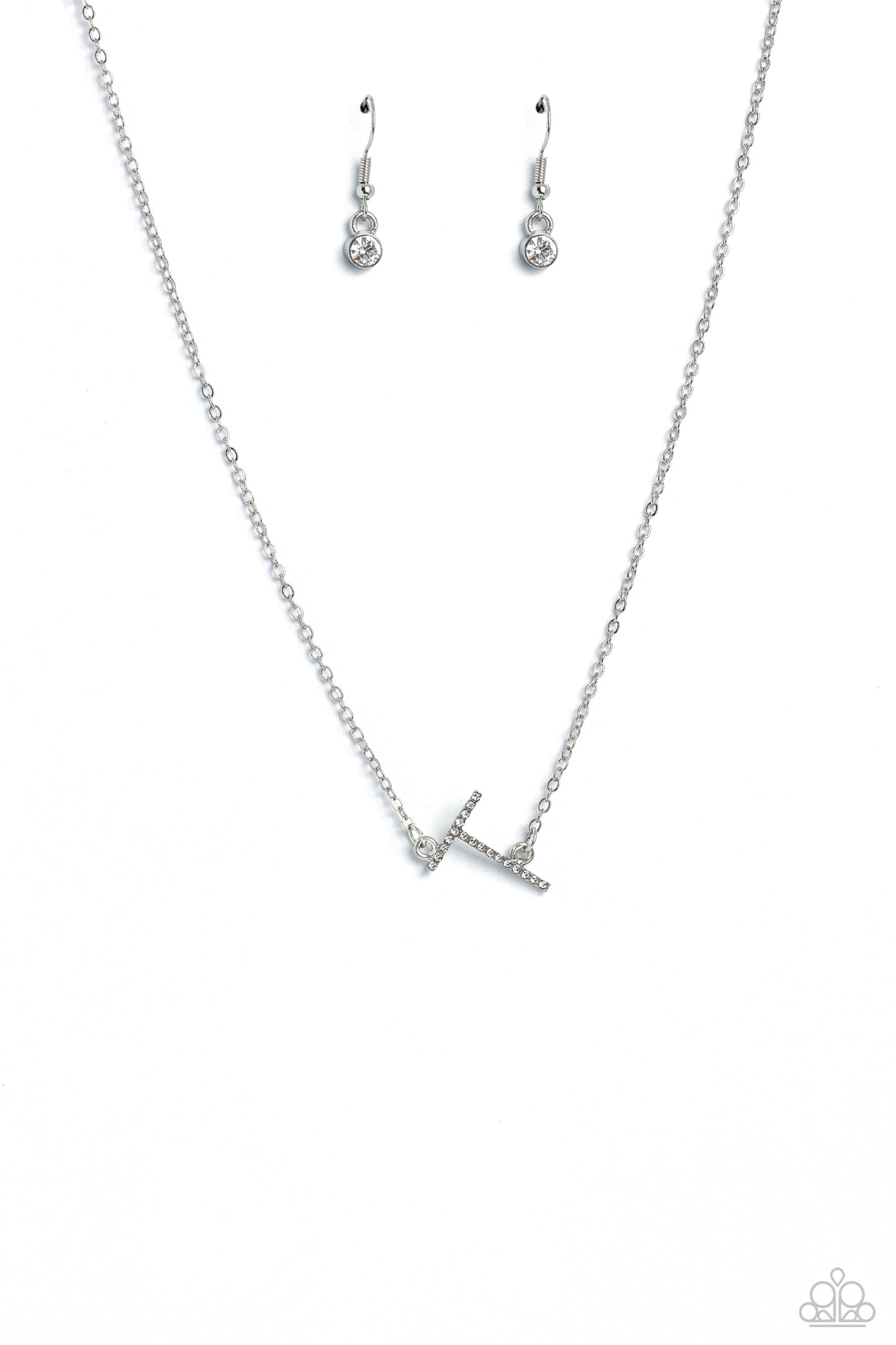 Paparazzi Accessories INITIALLY Yours - T - White Embossed with dainty white rhinestones, a silver letter "T" hovers below the collar from a dainty silver chain, for a sentimentally simple design. Features an adjustable clasp closure. Sold as one individu