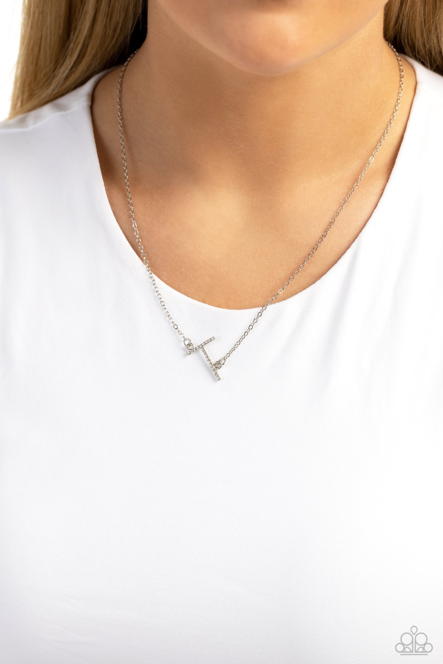 Paparazzi Accessories INITIALLY Yours - T - White Embossed with dainty white rhinestones, a silver letter "T" hovers below the collar from a dainty silver chain, for a sentimentally simple design. Features an adjustable clasp closure. Sold as one individu