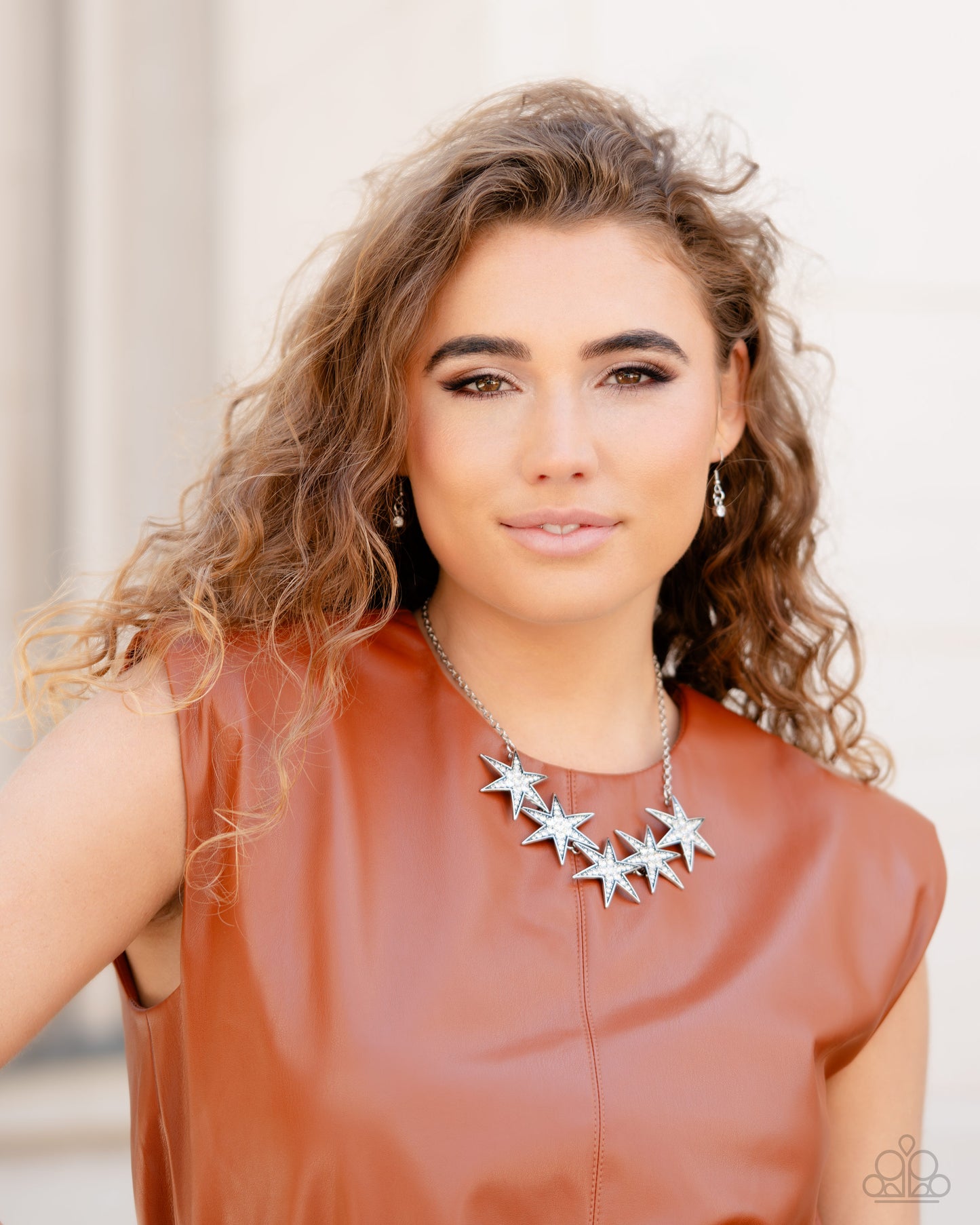 Paparazzi Accessories Rockstar Ready - White Dotted with various sizes of highly reflective white rhinestones, a stellar collection of 3D silver stars interlock from a dainty silver link chain for an out-of-this-world edgy fashion. Features an adjustable