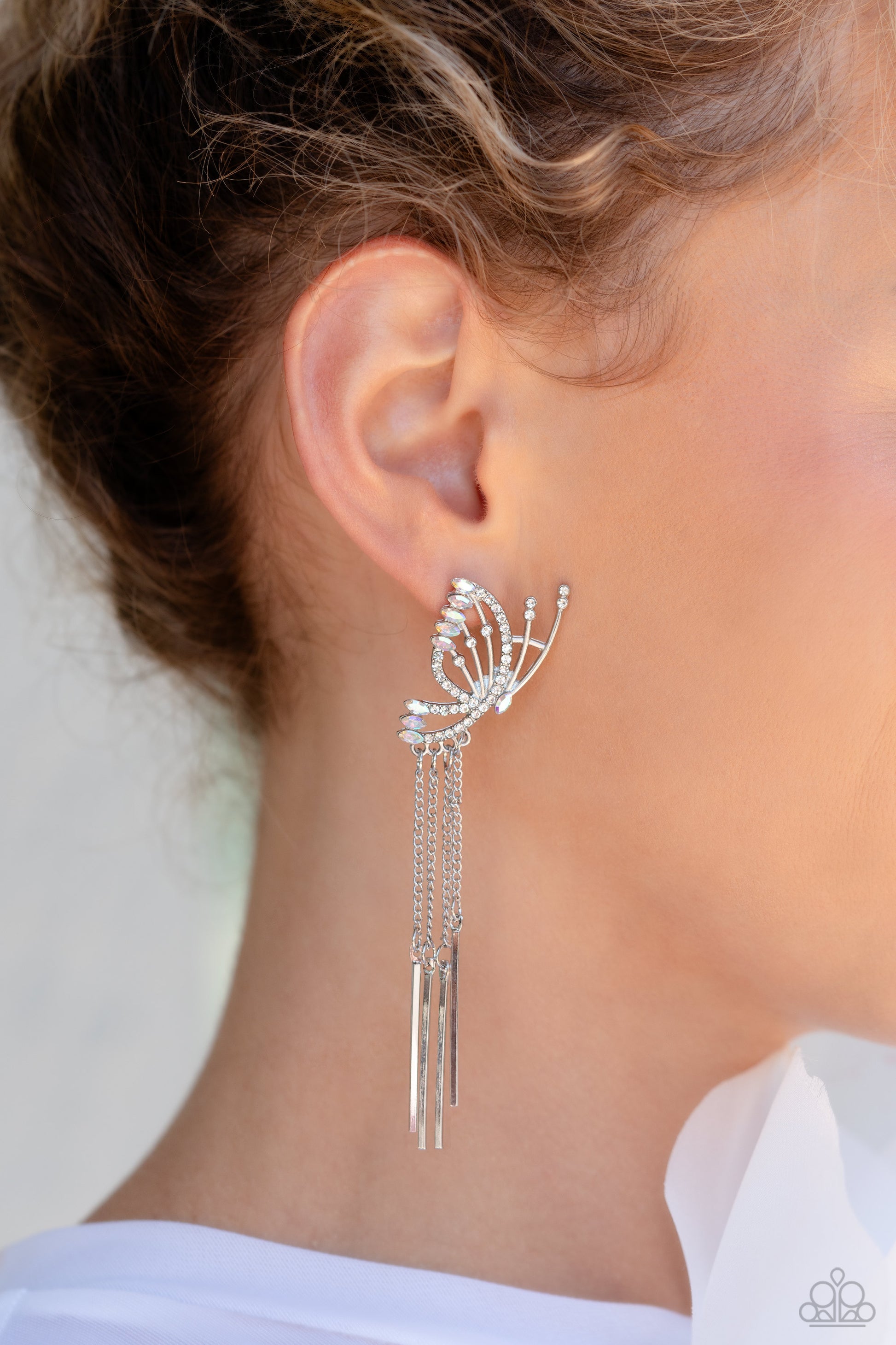 Paparazzi Accessories A Few Of My Favorite WINGS - White Featuring dainty white rhinestones and dainty marquise-cut iridescent gems, a thin, elongated, airy silver butterfly is titled to the side as if about to take off in flight. A collection of dainty s