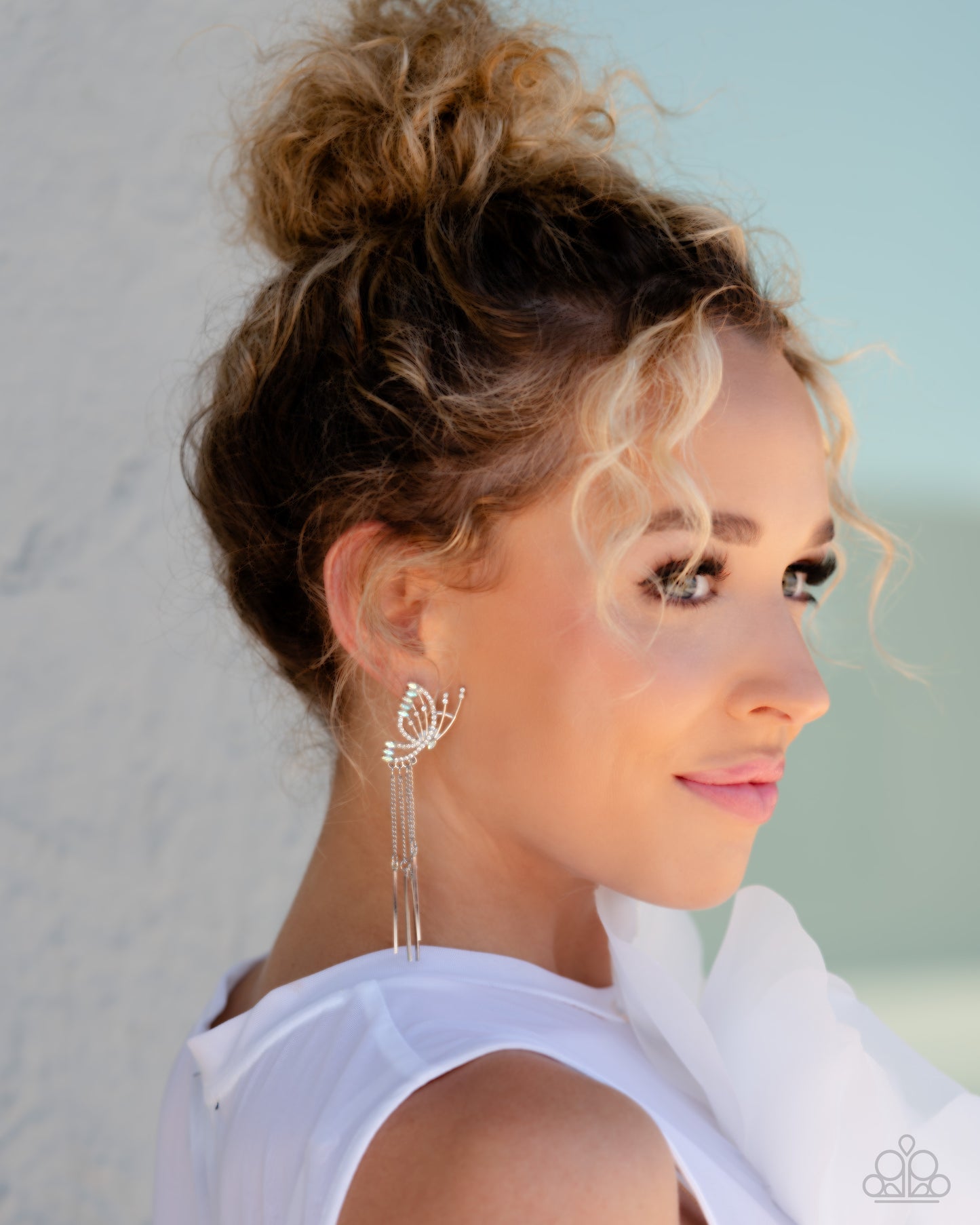 Paparazzi Accessories A Few Of My Favorite WINGS - White Featuring dainty white rhinestones and dainty marquise-cut iridescent gems, a thin, elongated, airy silver butterfly is titled to the side as if about to take off in flight. A collection of dainty s