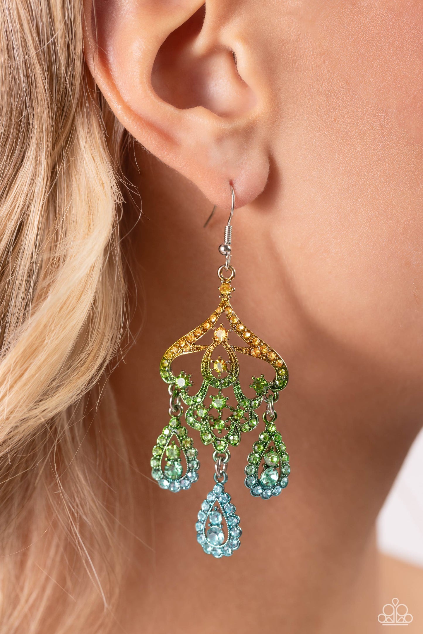 Paparazzi Accessories Chandelier Command - Multi 3 Three rhinestone-encrusted teardrops drip from the bottom of an ornate decorative frame, creating an elegant fringe. The decorative frame swirls with ombré rhinestones that go from yellow to green to blue