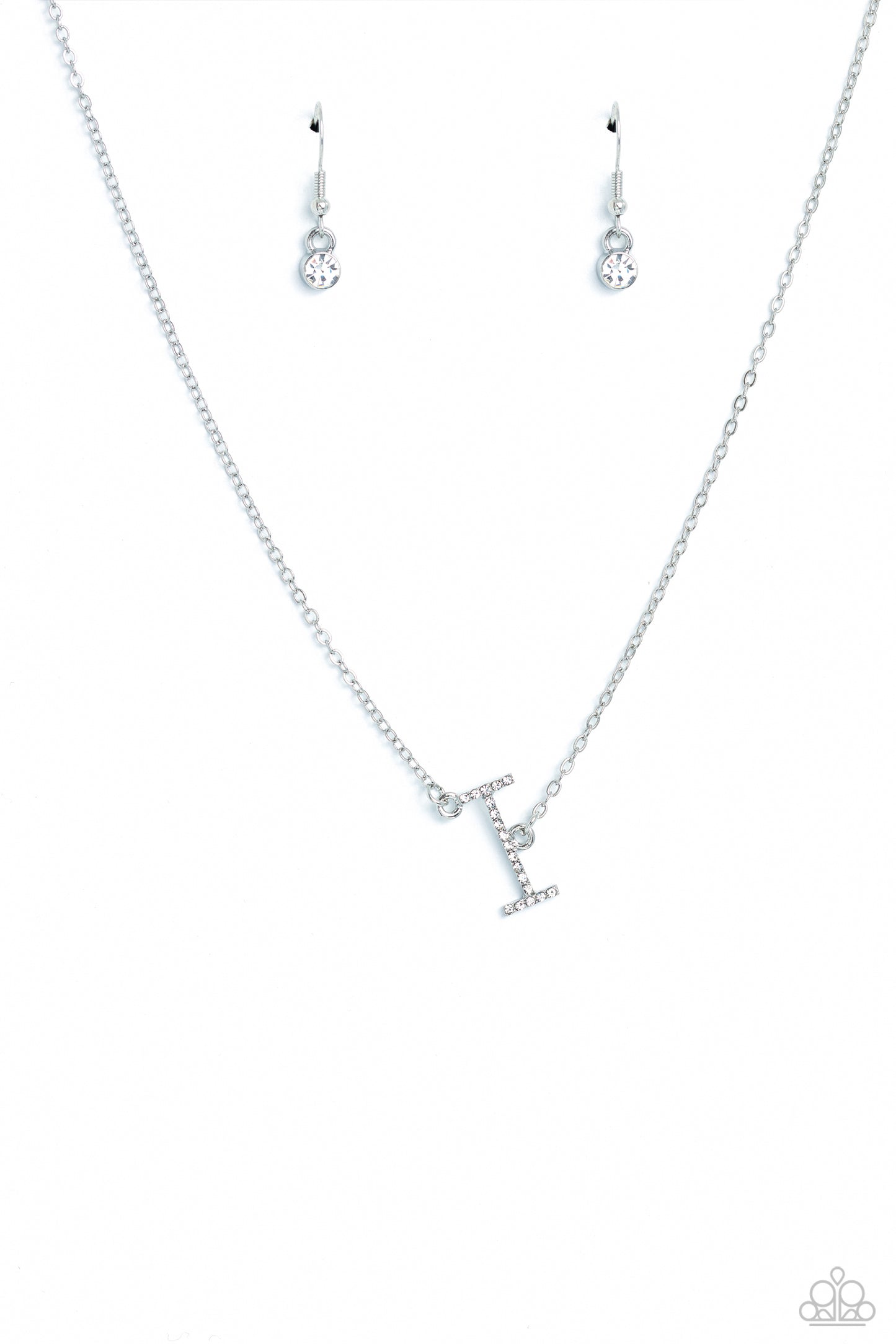 Paparazzi Accessories INITIALLY Yours - I - White Embossed with dainty white rhinestones, a silver letter "I" hovers below the collar from a dainty silver chain, for a sentimentally simple design. Features an adjustable clasp closure. Sold as one individu