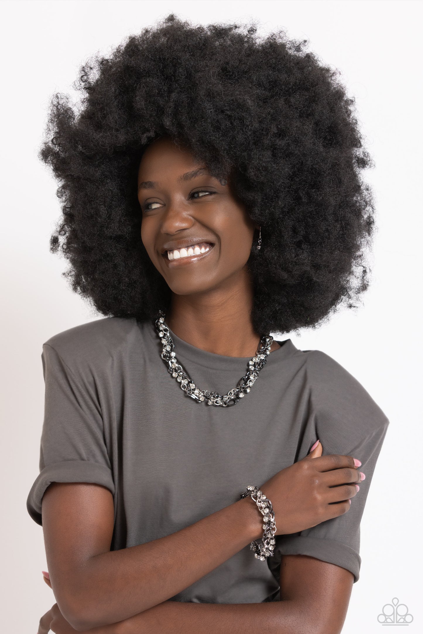 Paparazzi Accessories Totally Two-Toned - Silver Mismatched strands of glistening shiny gunmetal and silver oval links are intertwined with a row of sparkling, square-cut, white rhinestones encased in sleek shiny silver fittings, resulting in a twisted co