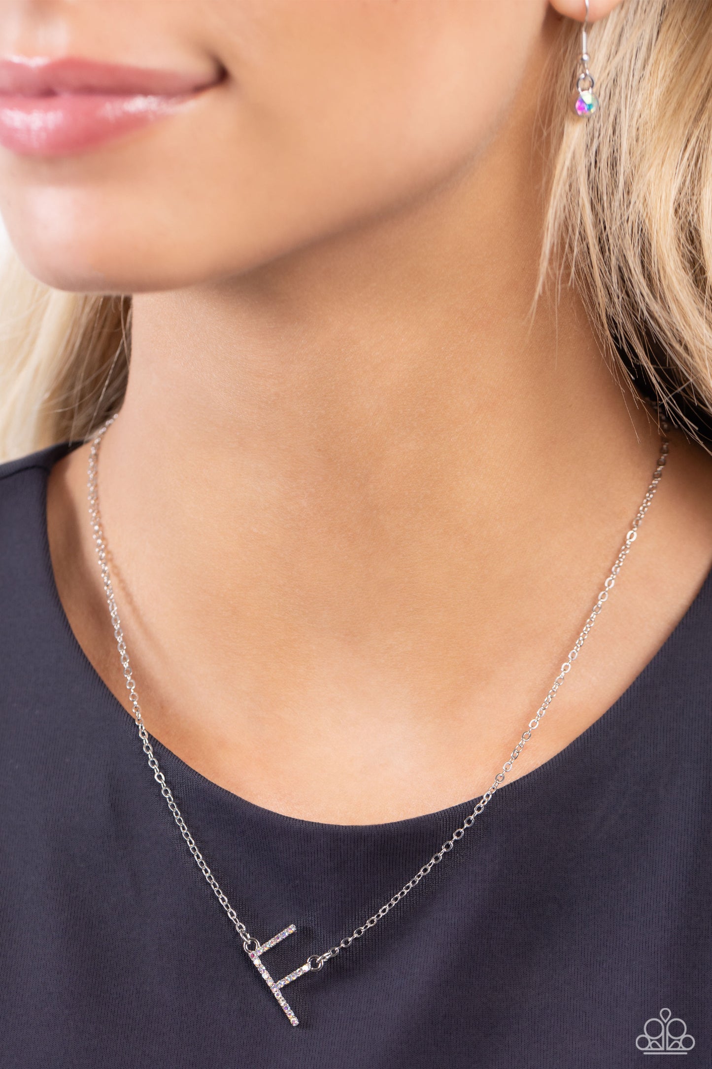 Paparazzi Accessories INITIALLY Yours - F - Multi Embossed with dainty iridescent rhinestones, a silver letter "F" hovers below the collar from a dainty silver chain, for a sentimentally simple design. Features an adjustable clasp closure. Due to its pris