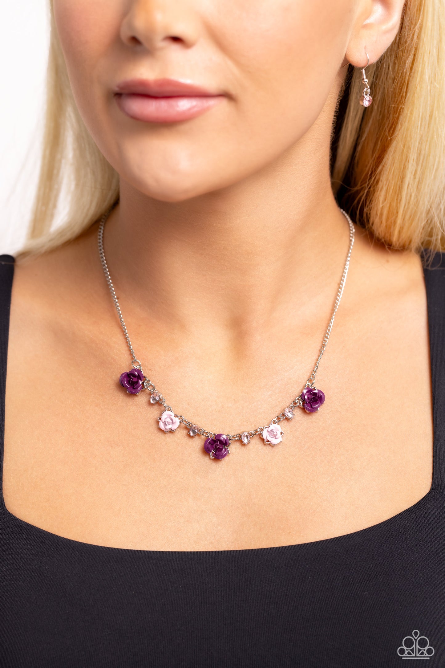 Paparazzi Accessories Strike a ROSE - Purple Painted in plum and baby pink hues, various metal roses delicately alternate with upside-down pink teardrop gems across a dainty silver chain, blooming into a seasonal centerpiece. Features an adjustable clasp