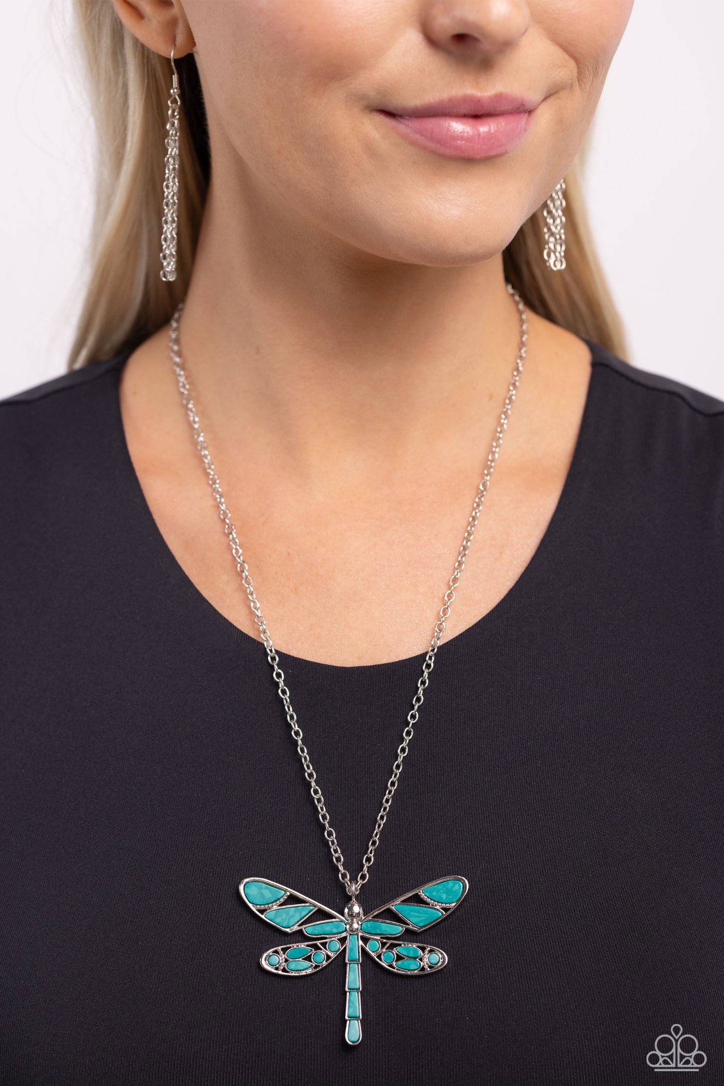 Paparazzi Accessories FLYING Low - Green Featuring a classic silver chain, various cuts of green, teal-like stone are passed into an oversized, airy silver dragonfly pendant for a rustically earthy centerpiece. Features an adjustable clasp closure. As the