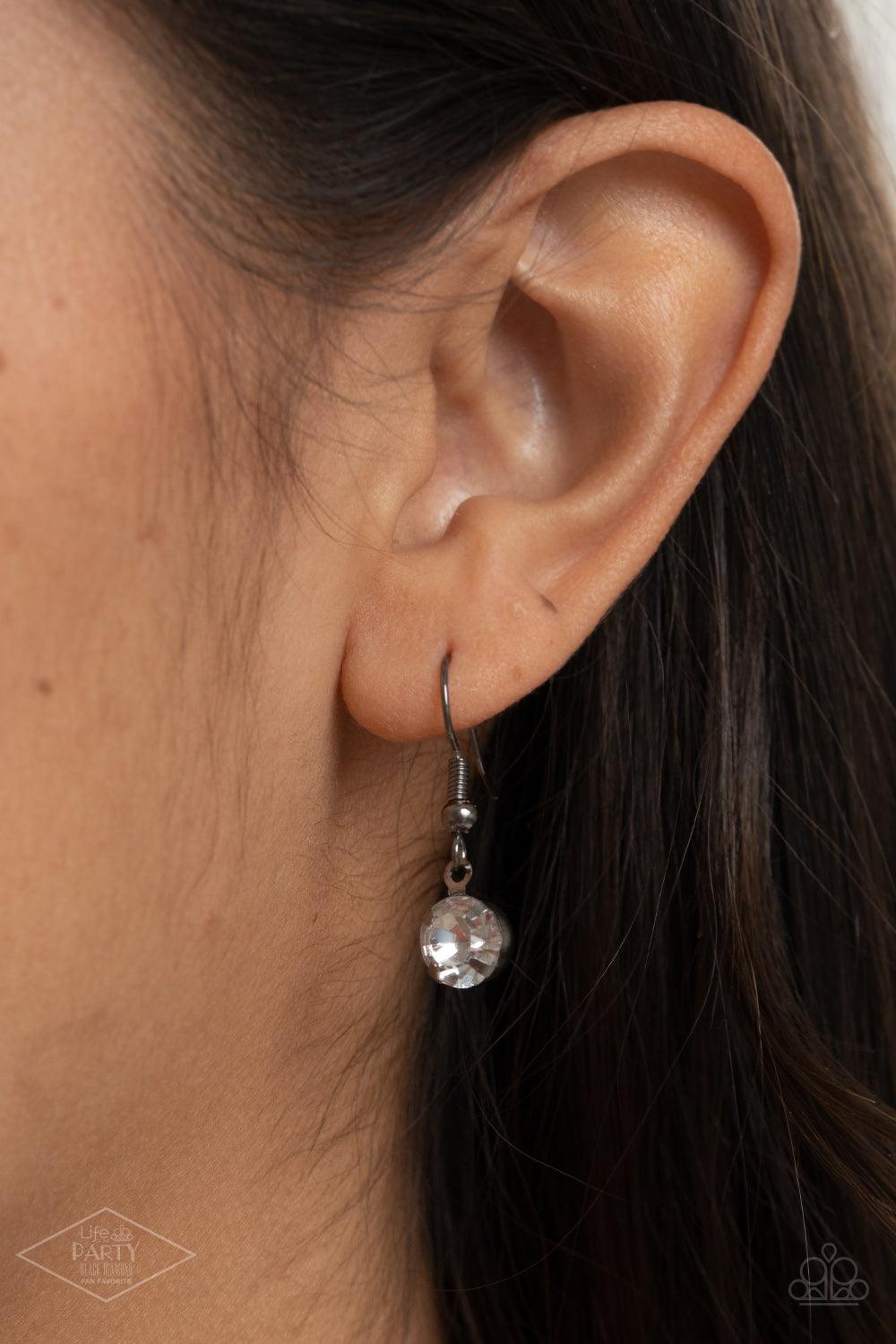 Paparazzi Accessories What A Gem - Gunmetal A single rhinestone sparkles brilliantly at the bottom of a dainty gunmetal chain, creating a stunning solitaire design. Features an adjustable clasp closure. Sold as one individual necklace. Includes one pair o