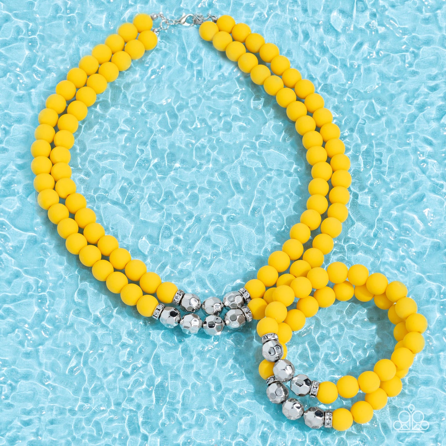 Paparazzi Accessories Summer Splash - Yellow Threaded along invisible wires, matte-finished Daffodil beads give way to center sections of white rhinestone encrusted rings and faceted silver beads. The sunny display layers below the collar, creating a summ