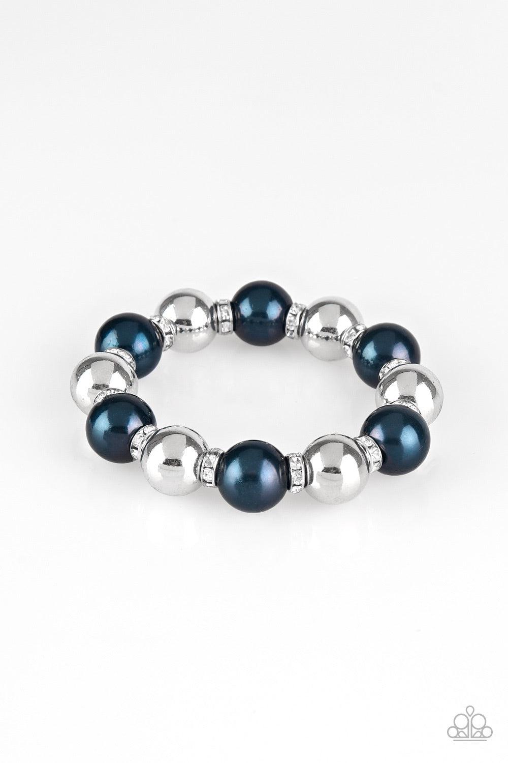 Paparazzi Accessories So Not Sorry - Blue A collection of white rhinestone encrusted rings, blue pearls, and classic silver beads are threaded along a stretchy band around the wrist for a glamorous look. Jewelry