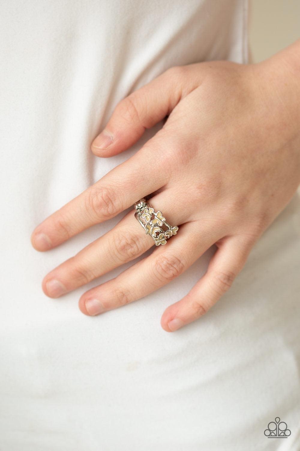 Paparazzi Accessories Fluttering Fashion - Brown Painted in the neutral hue of Soybean, dainty silver butterflies flutter across arcing silver bars for a whimsical fashion. Features a dainty stretchy band for a flexible fit. Jewelry