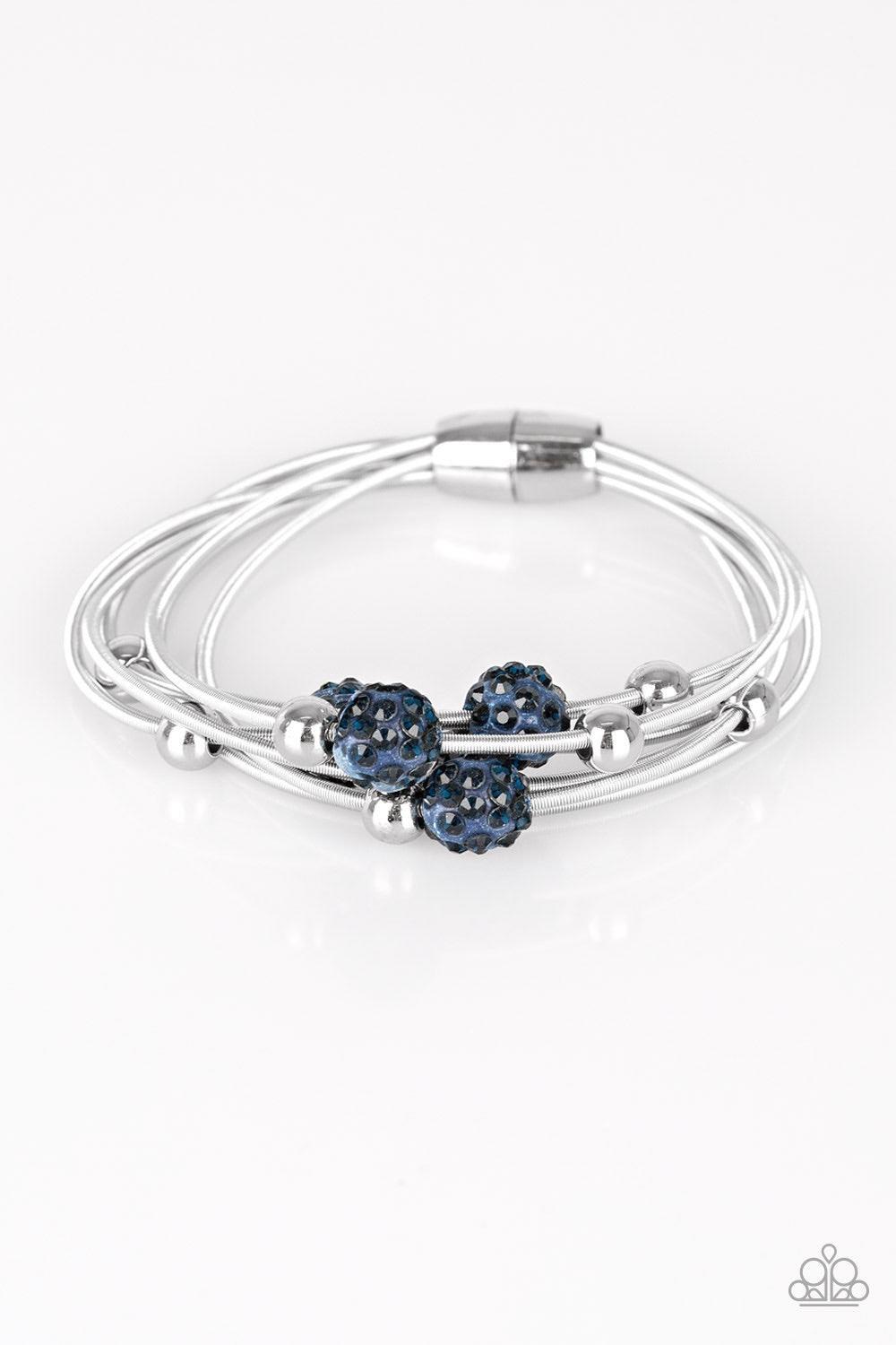 Paparazzi Accessories Marvelously Magnetic - Blue Radiating in blue rhinestones, glittery blue beads and classic silver beads are threaded along stretchy spring-like wires for a refined look. Features a magnetic closure. Jewelry