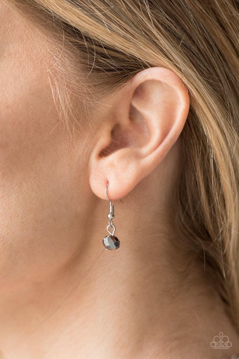 Paparazzi Accessories Let’s Get This FASHION Show On The Road - Silver Featuring a metallic shimmer, faceted hematite beads swing from the bottom of bold silver links. Clusters of faceted silver beads join the metallic gems, creating a dramatic fringe bel