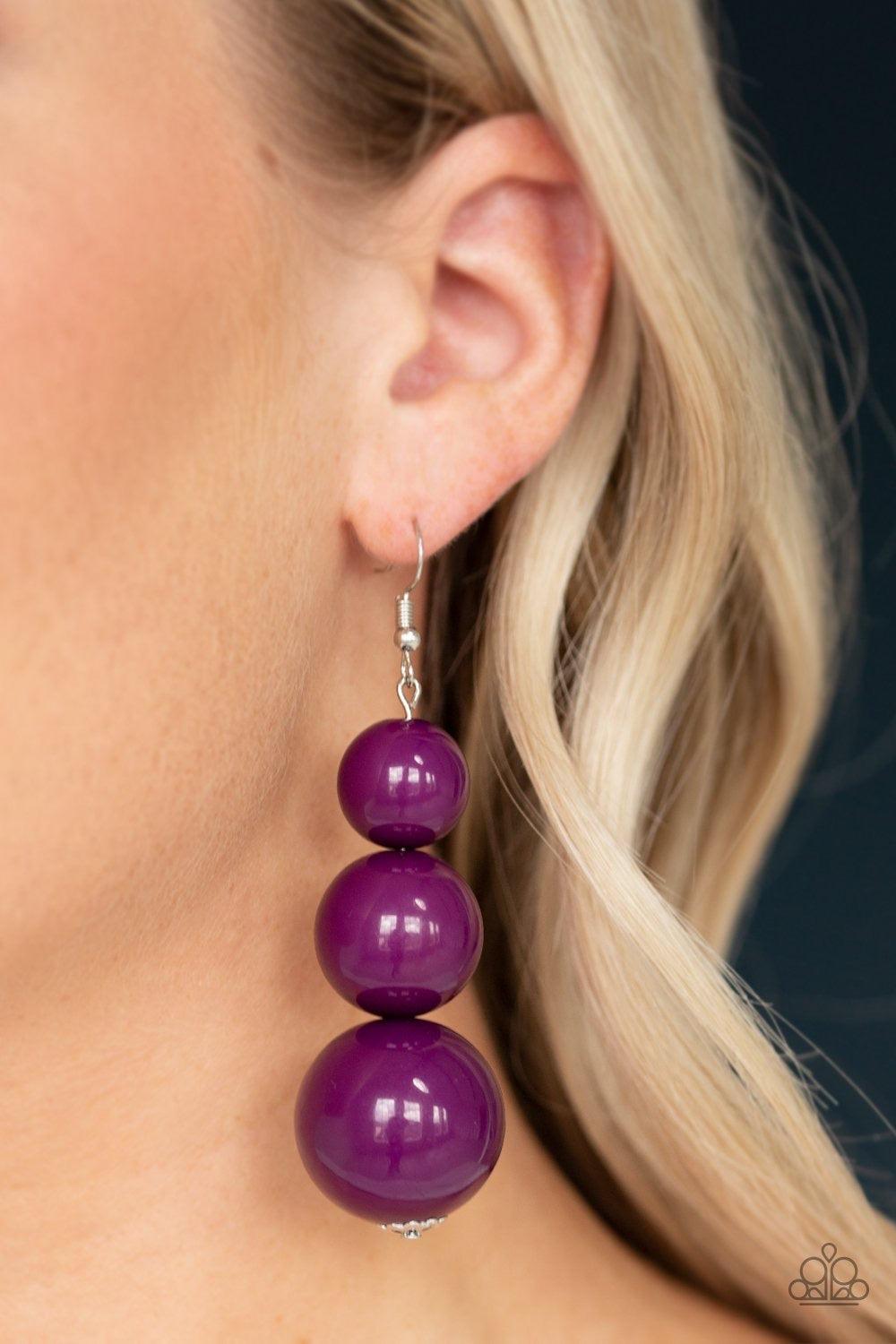 Paparazzi Accessories Material World - Purple Over sized purple beads gradually increase in size as they drip from the ear, coalescing into a colorful statement piece. Earring attaches to a standard fishhook fitting. Jewelry