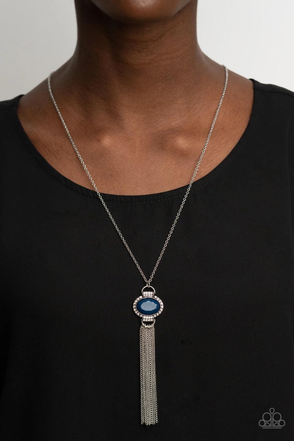Paparazzi Accessories What Glows Up - Blue Bordered in glassy white rhinestones, a faceted blue bead dotted frame gives way to a curtain of shimmery silver chains, creating a glamorous pendant. Features an adjustable clasp closure. Sold as one individual
