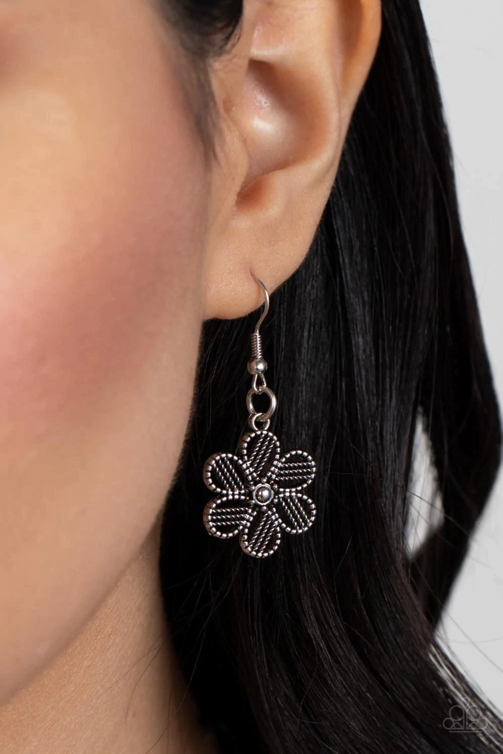 Paparazzi Accessories Basketful of Blossoms - Silver Featuring metallic wicker-like patterns, stacks of teardrop and heart shaped filigree-filled silver petals delicately link into a decorative row of flowers. The floral frames gradually increase in size