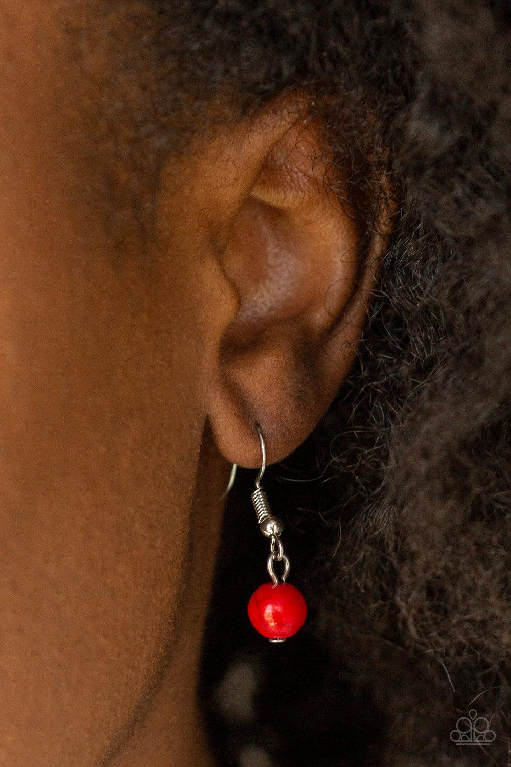 Paparazzi Accessories Santa Fe Solstice - Red Dotted with fiery red stone centers, two ornate frames link below the collar. Strands of silver beads are threaded through the uppermost pendant, adding an antiqued flair to the tribal inspired pendant. Featur