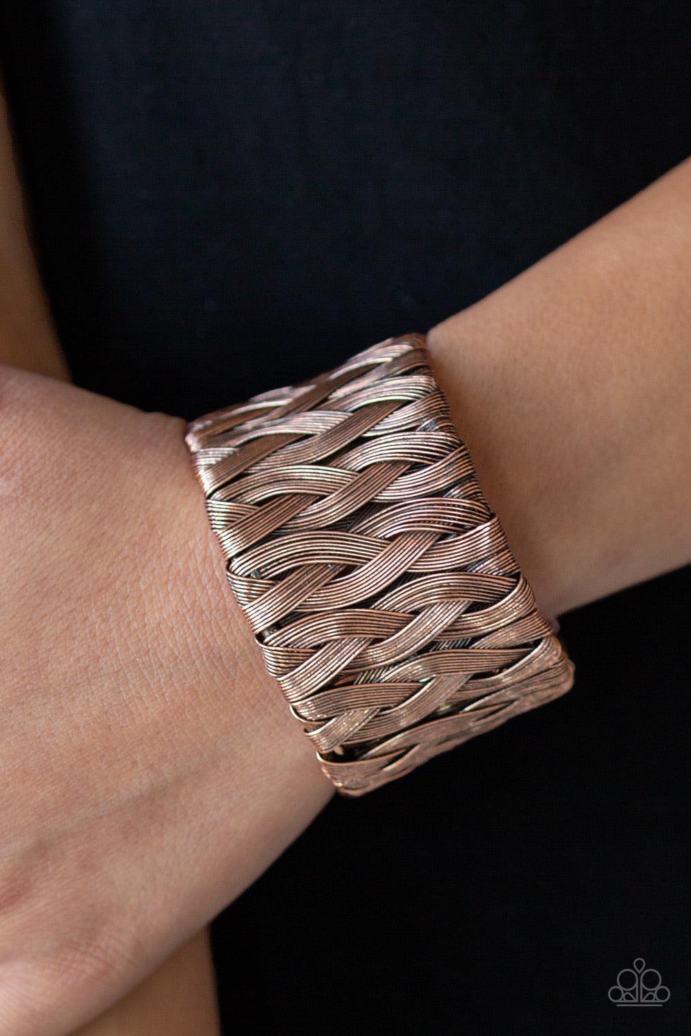 Paparazzi Accessories Take It Or WEAVE It - Copper Brushed in an antiqued shimmer, flat wire-like bars weave across the wrist, coalescing into an edgy cuff. Jewelry