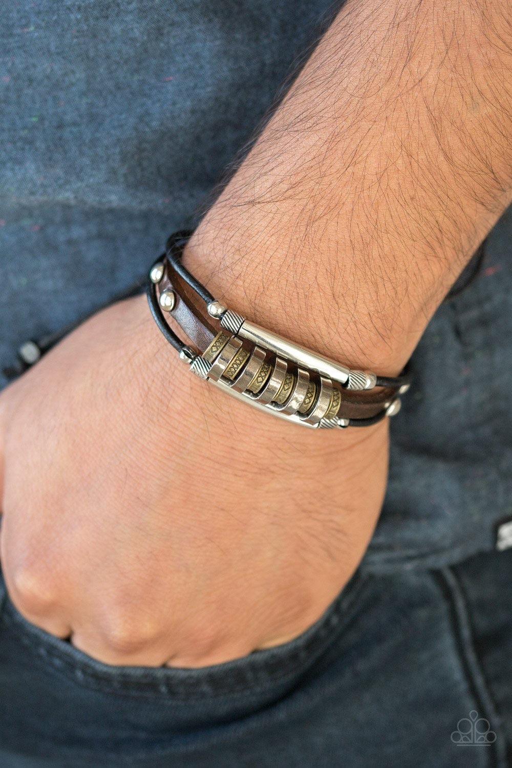 Paparazzi Accessories Urban Backpacker ~Black Mismatched mixed metallic accents slide along black and brown leather bands for a stacked rugged look. Features an adjustable sliding knot closure.