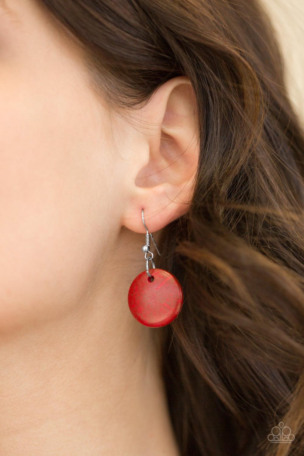Paparazzi Accessories Bermuda Beach House - Red Tinted in a fiery red finish, distressed wooden discs trickle along strands of knotted brown cording, creating colorful layers below the collar for a seasonal vibe. Features a button-loop closure. Sold as on