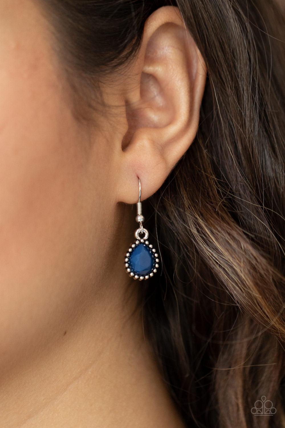 Paparazzi Accessories Breathtaking Brilliance - Blue Featuring smooth and studded silver frames, a collection of teardrop, oval, and triangular blue beads coalesce with matching white rhinestones below the collar for a glamorous pop of collar. Features an