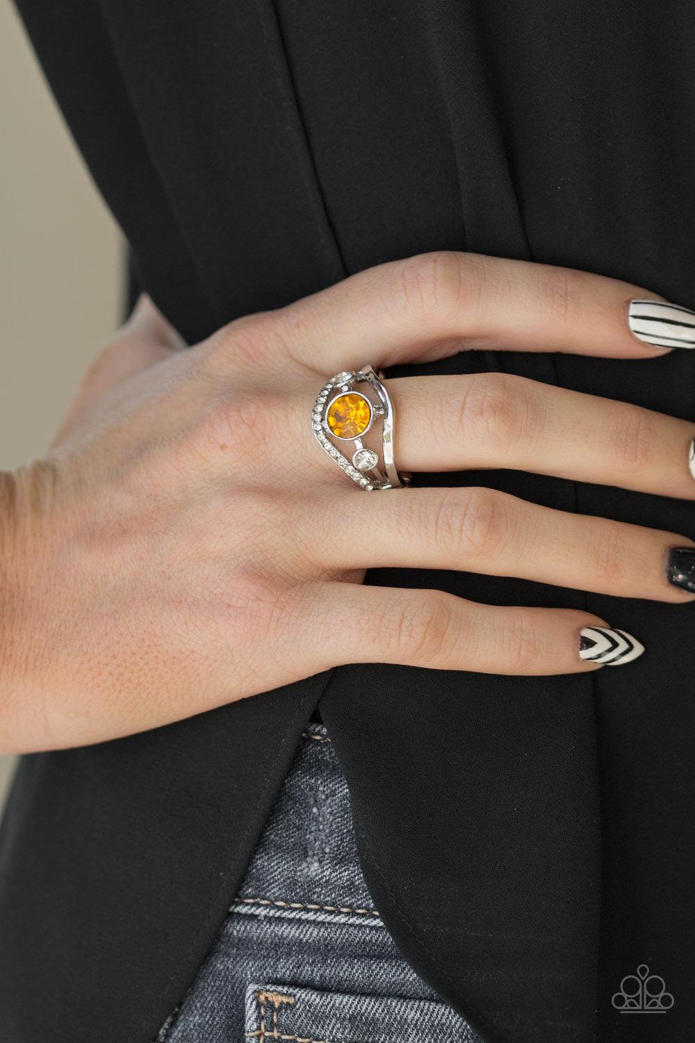 Paparazzi Accessories Rich with Richness - Yellow A white rhinestone encrusted band and glistening silver band wave around a radiating yellow and white rhinestone center for a refined look. Features a dainty stretchy band for a flexible fit. Jewelry