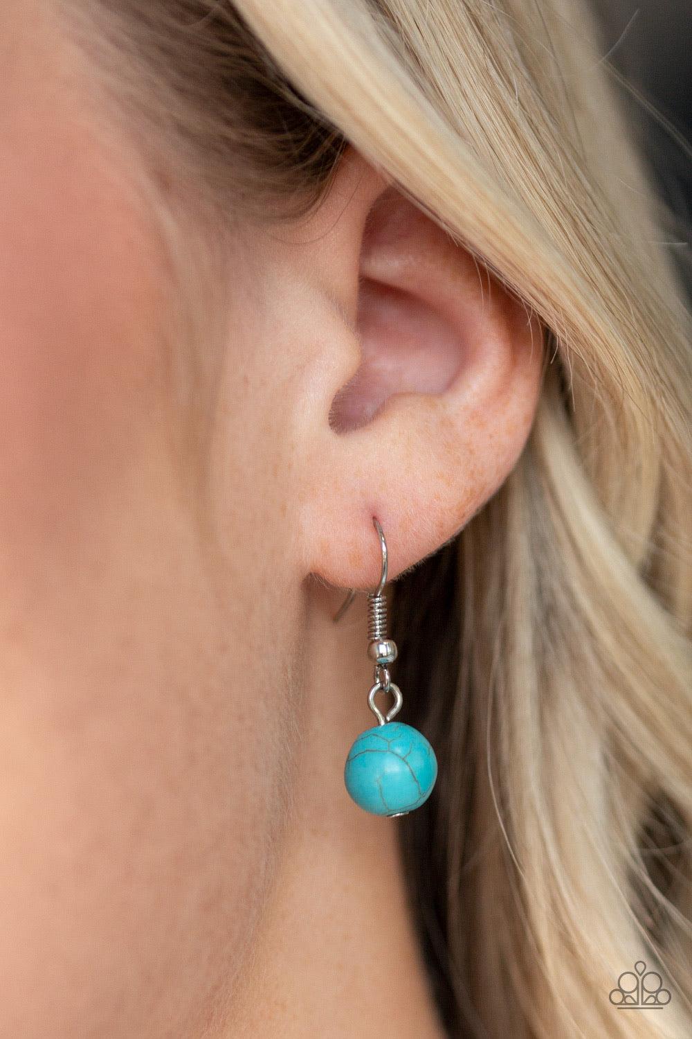 Paparazzi Accessories Sedona Drama ~Blue Featuring floral, textured, and refreshing turquoise stone accents, a collection of unique silver frames link below the collar for a seasonal flair. A dramatically oversized turquoise stone pendant dangles from the