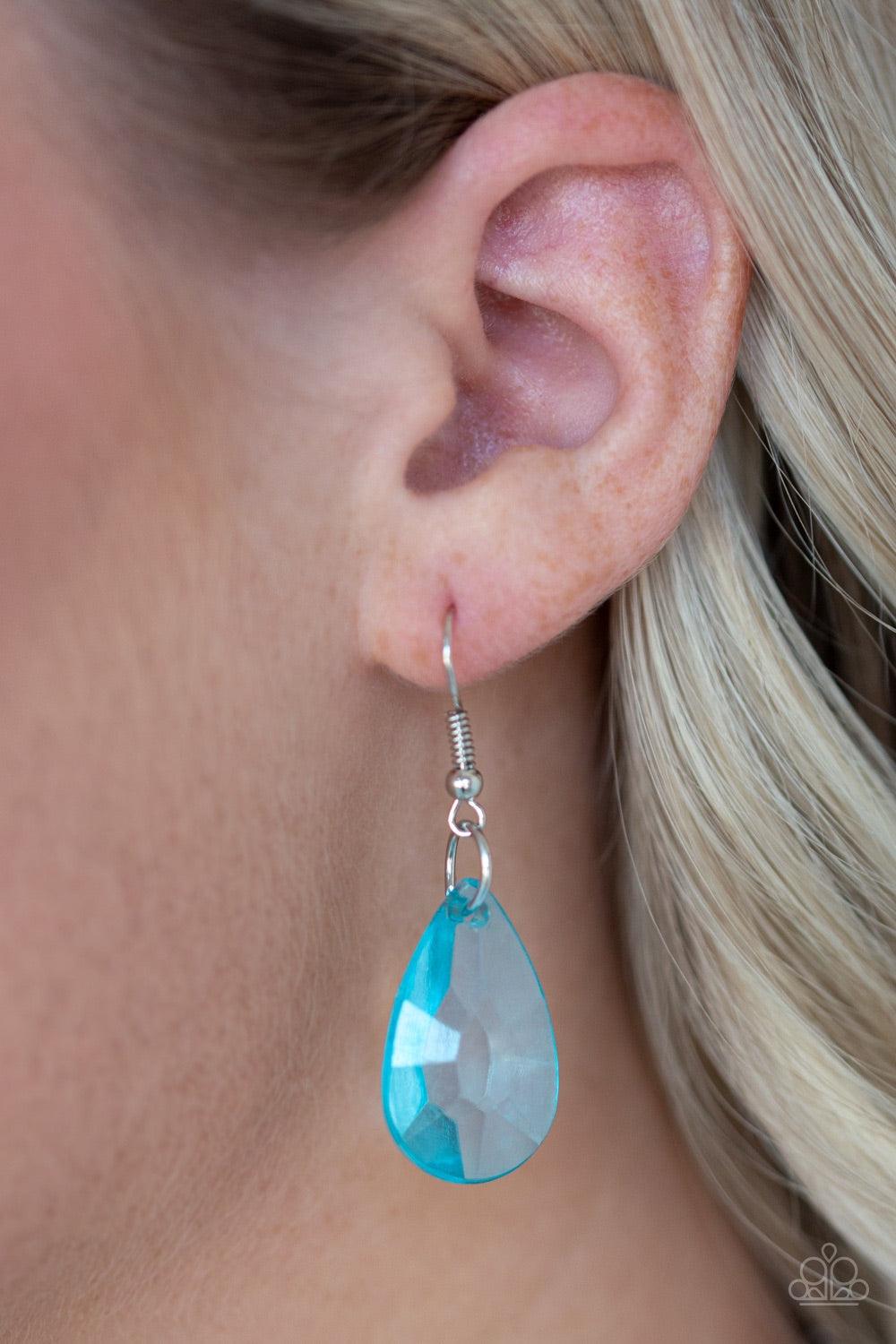 Paparazzi Accessories Irresistible Iridescence - Blue Glassy blue teardrop beads swing from the bottom of a shimmery silver chain. Matching beads trickle down free-falling chains, creating a glamorous fringe below the collar. Features an adjustable clasp