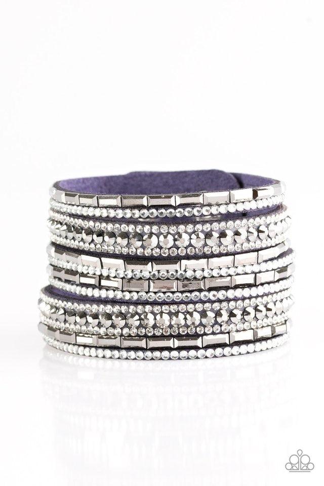 Paparazzi Accessories Wham Bam Glam - Blue Varying in size and shape, glassy white and smoky hematite rhinestones are encrusted along strands of blue suede for a sassy look. Features an adjustable snap closure. Jewelry
