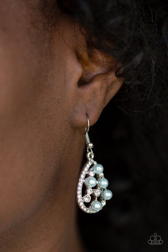Paparazzi Accessories Fabulously Wealthy - Blue Glassy white rhinestones and pearly blue beads are sprinkled along the center of a rhinestone encrusted teardrop for a glamorous look. Earring attaches to a standard fishhook fitting. Jewelry
