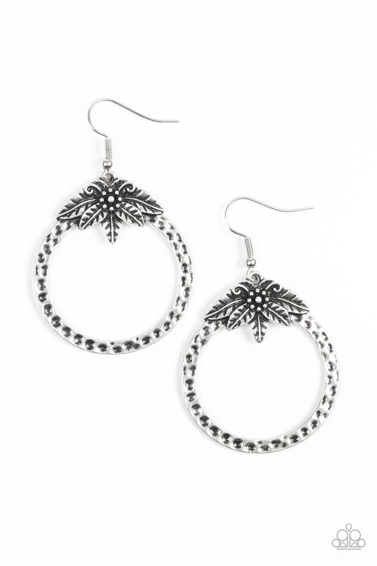 Paparazzi Accessories Island Insider - Silver Featuring lifelike details, a flowery frame blooms across the top of a hammered silver hoop for a seasonal look. Earring attaches to a standard fishhook fitting. Jewelry