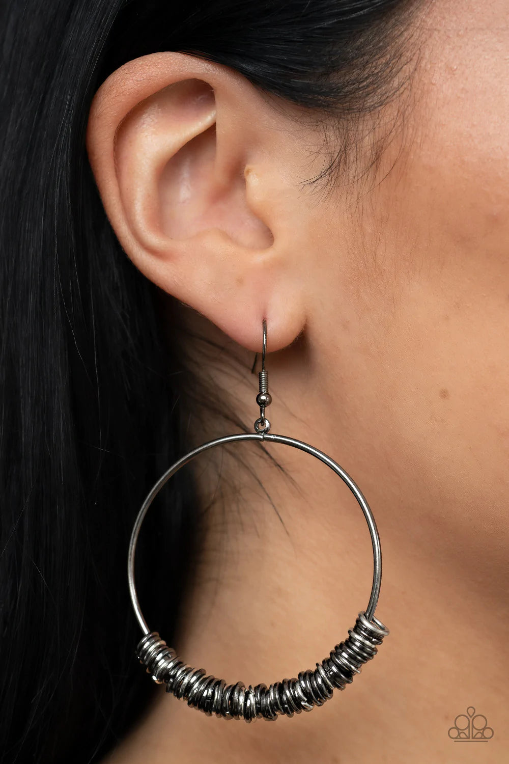 Paparazzi Accessories Retro Ringleader - Multi An abundance of miniature gunmetal and silver rings slide around a simple gunmetal front-facing hoop, resulting in a polished industrial vibe. Earring attaches to a standard fishhook fitting. Sold as one pair