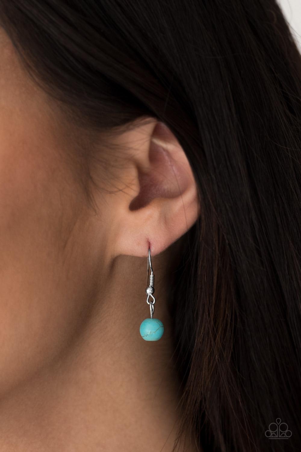 Paparazzi Accessories Mountain Roamer - Blue Chiseled into tranquil circles, smooth turquoise stones are pressed into ornate silver frames and linked below the collar for a tribal inspired look. Features an adjustable clasp closure. Sold as one individual