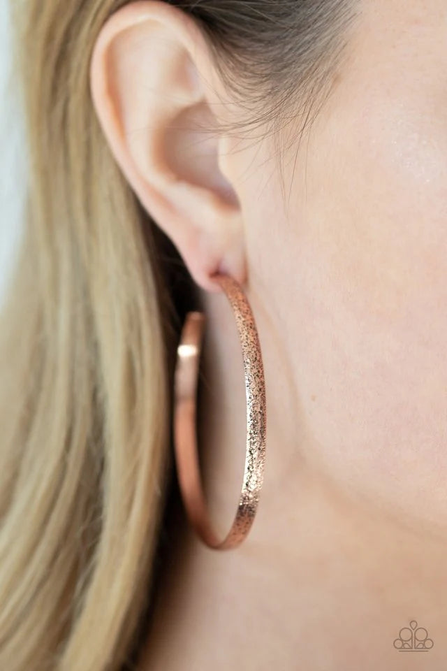Paparazzi Accessories Rustic Radius - Copper Delicately hammered in rustic shimmer, a shimmery copper bar curls around the ear, creating an oversized hoop. Earring attaches to a standard post fitting. Hoop measures approximately 2 1/4" in diameter. Earrin