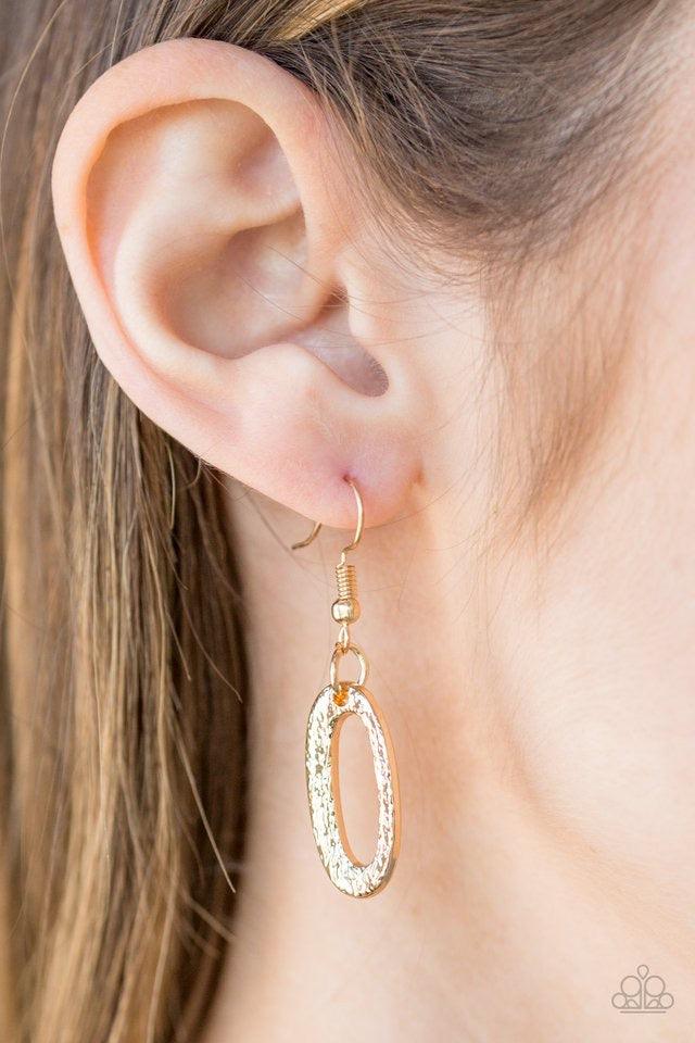 Paparazzi Accessories Easy, TIGRESS! - Gold Embossed in radiating textures, asymmetrical gold ovals link below the collar in a fierce fashion. Features an adjustable clasp closure. Sold as one individual necklace. Includes one pair of matching earrings. J