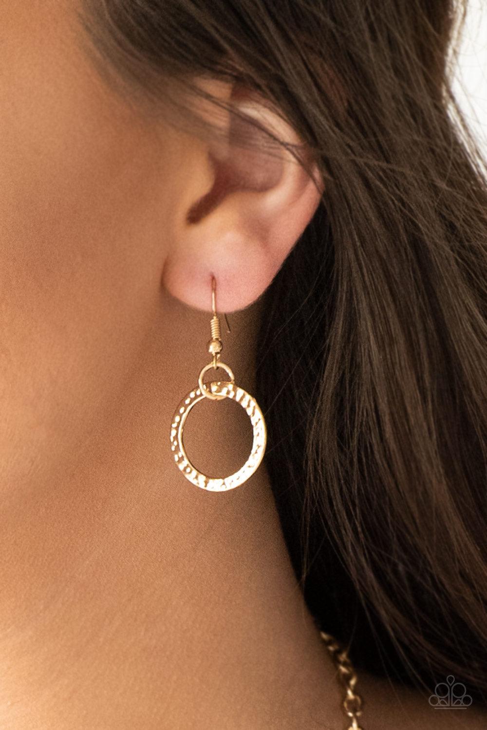 Paparazzi Accessories Coast Coasting - Gold Brushed in an iridescent finish, shell-like hoops join mismatched gold hoops at the bottom of an elongated gold chain for a whimsical look. Features an adjustable clasp closure. Jewelry