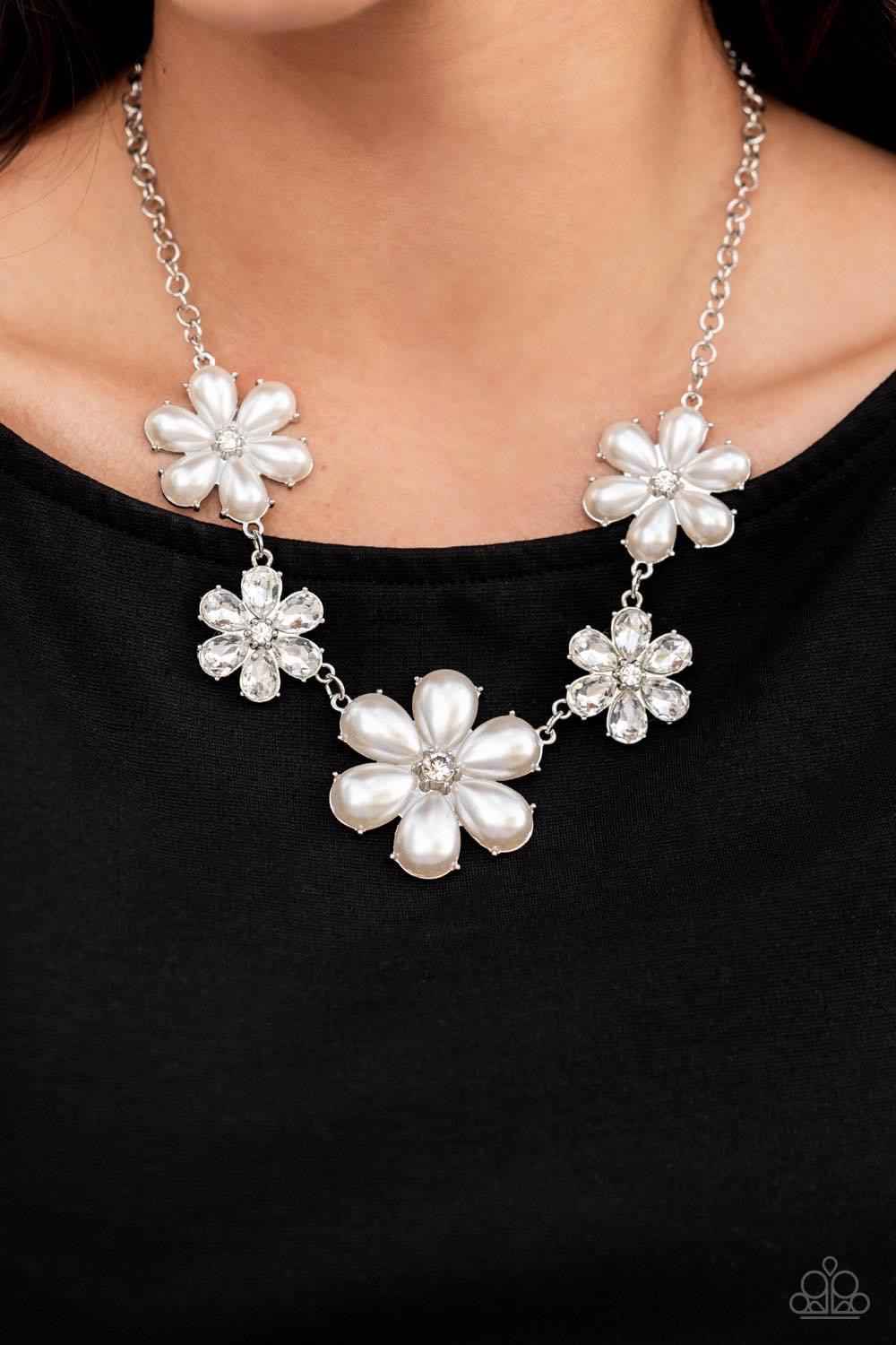 Paparazzi Accessories Fiercely Flowering - White Featuring glassy white rhinestone centers, bubbly pearl petaled flowers gradually increase in size as they alternate with white rhinestone petaled flowers below the collar for a fierce floral fashion. Featu