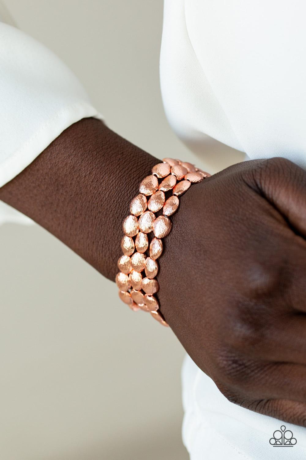 Paparazzi Accessories Basic Bliss - Copper Radiating with shimmery textures, dainty shiny copper beads are threaded along stretchy bands around the wrist for a casually layered look. Sold as one set of three bracelets. Jewelry