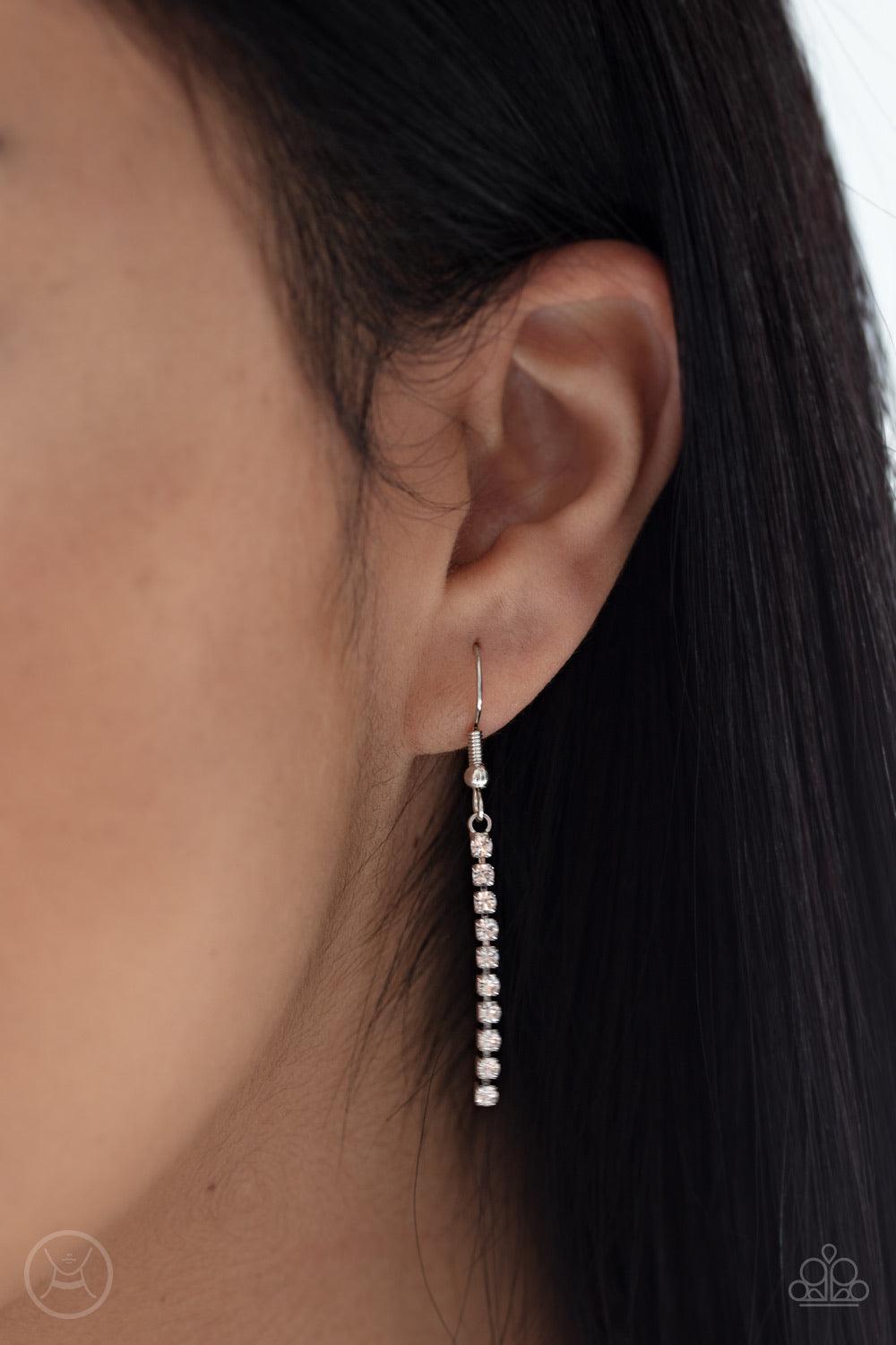 Paparazzi Accessories Double The Diva - White Interlocking strands of glittery white rhinestones wrap around the neck, creating double the drama as solitaire strands of rhinestones drip from a square center for a timelessly tasseled look. Features an adju