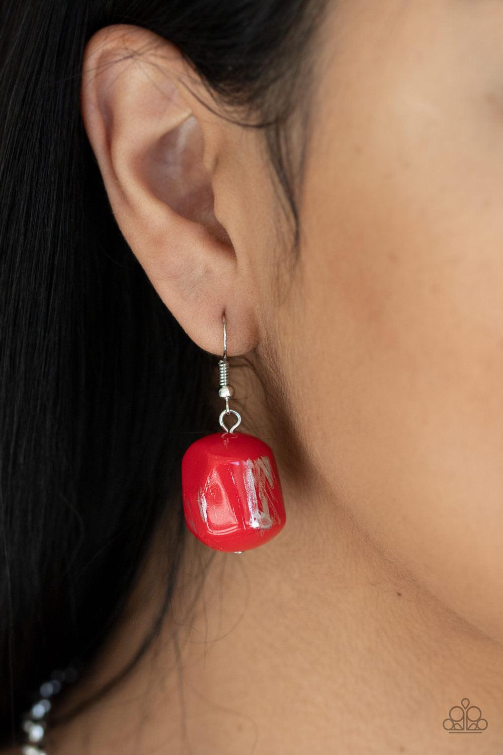 Paparazzi Accessories Girl Grit - Red Featuring a scratched metallic finish, faceted red beads and shimmery silver accents are threaded along an invisible wire below the collar for a colorful look. Features an adjustable clasp closure. Sold as one individ