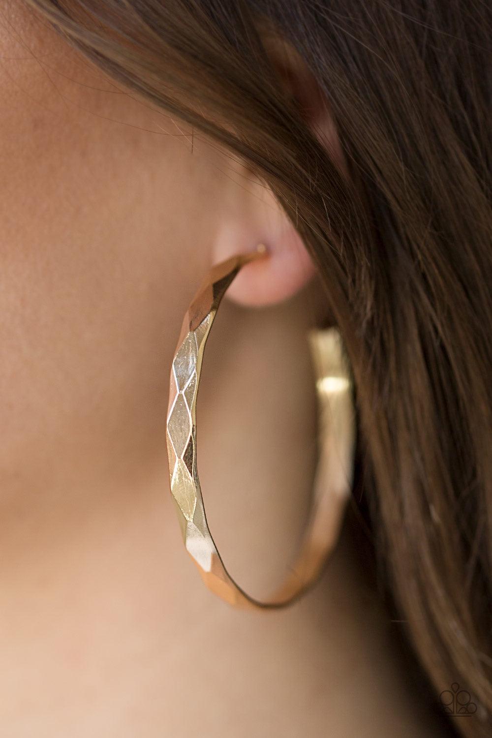 Paparazzi Accessories Hey, HAUTE Stuff - Gold Featuring edgy diamond-cut texture, a glistening gold hoop curls around the ear in a bold industrial fashion. Earring attaches to a standard post fitting. Hoop measures 2 1/4โ in diameter. Jewelry