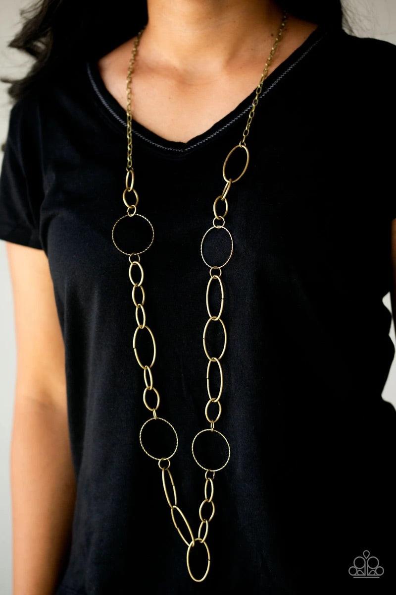 Paparazzi Accessories Perfect MISMATCH - Brass An array of smooth and textured brass hoops connect across the chest, creating a bold mismatched palette. Features an adjustable clasp closure. Sold as one individual necklace. Includes one pair of matching e
